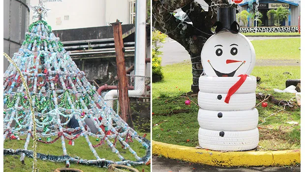 Christmas Tree made of plastic bottles and snowman from painted tires