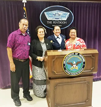 Cong. Aumua Amata congratulates newly promoted Major Mercy Te’o with her parents Su’a Philo and Mrs. Jennings.