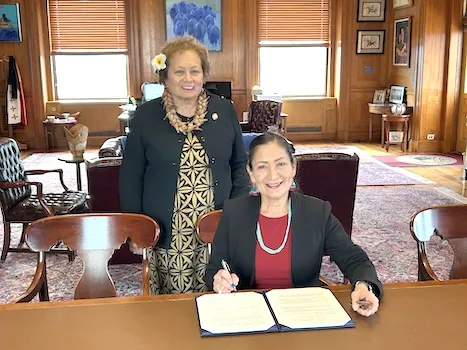 Congresswoman Uifa’atali Amata standing by Secretary Deb Haaland