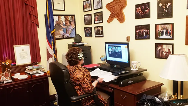 Aumua Amata in her D.C. office at computer during virtual forum