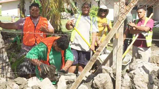 CJ Construction crew building a rock wall