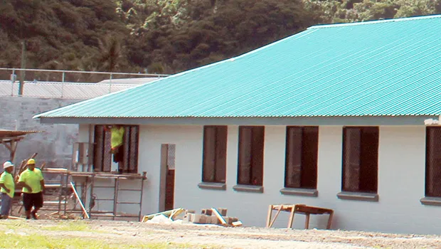 Construction workers at the new TAOA building going up in Tafuna.