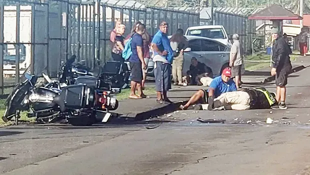 police motorcycle traffic accident with one on the ground