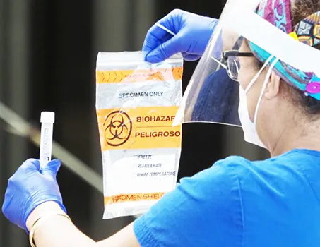 Healthcare worker with COVID-19 test kit