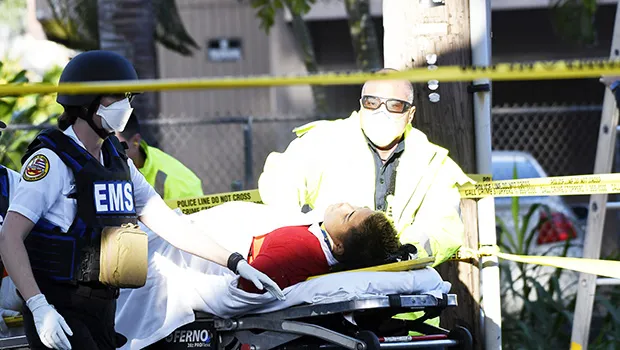 Firefighter continuing CPR on police shooting victim