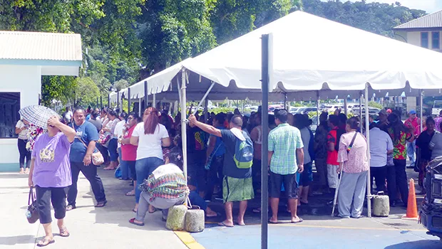 People crowded under the tents at Social Services in Utulei on Monday, April 20 for apparently Gita relief money.