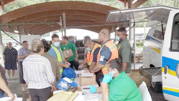 Custom's officers screening cargo off Lady Naomi