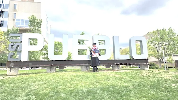 Darius McMoore in front of CSU sign