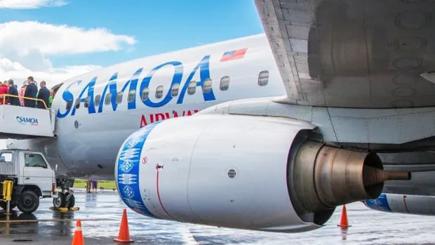 Passengers departing a Samoa Airways plane.