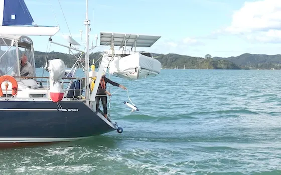 sailor deploying technology for e-DNA, biophysical sensors, and 3-D reconstruction of corals