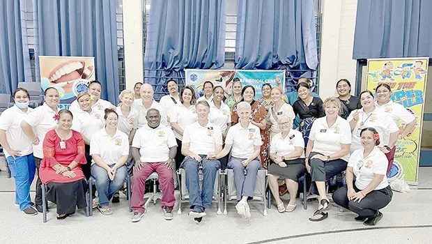 healthcare workforce pose for photo