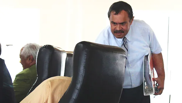 Department of Human and Social Services director, Muavaefa’atasi John Suisala shaking hands with lawmakers