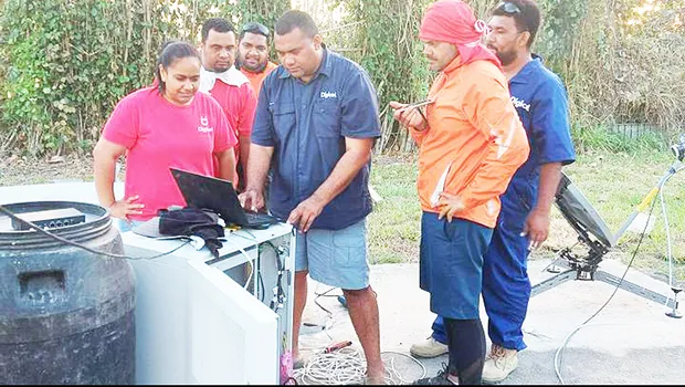 Digicel Tonga’s technical team working on satellite link equipment
