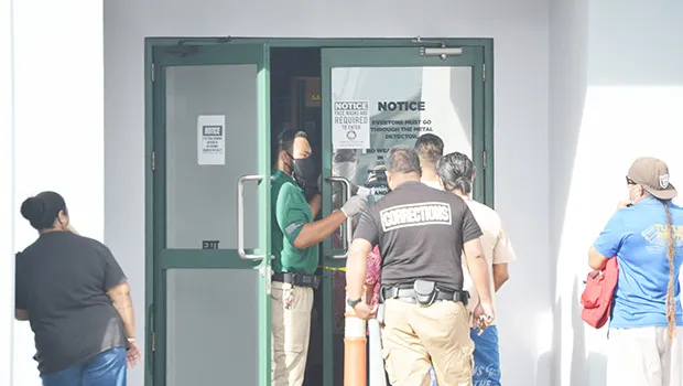 District Court house security check line at front door