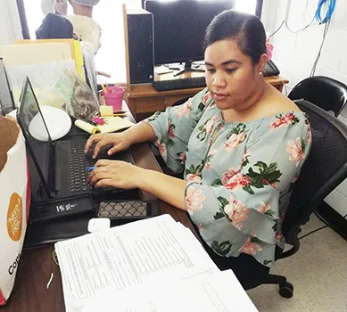 DMWR employee inputting data.