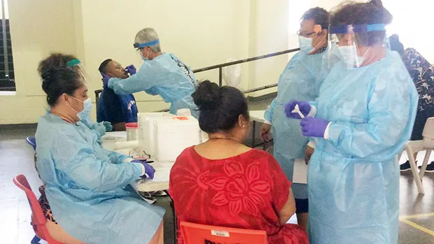 DoH staff at the Department of Youth and Women’s Affairs facility in Pago Pago conducting daily testing