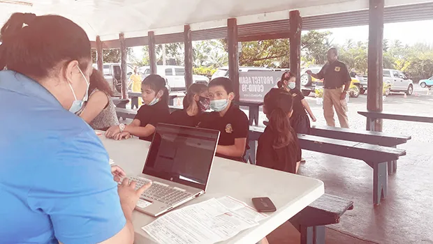 Children line up to get COVID vaccine