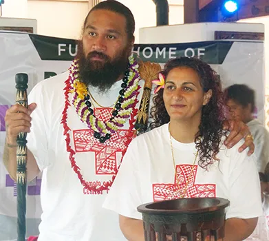 Denver Bronco’s Domata Peko (left) and his wife Ann