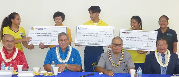 (Pictured l-r standing): Aitulagi Alofa, Gabriel Mendoza, Ben Schuster, Racquel Mamea, and Georgina Alofa, (l-r sitting): Vaito'a Hans Langkilde, Filifaatali Mike Fuiava, Governor Lolo Matalasi Moliga, and Pastor Lemmy Seumanu.