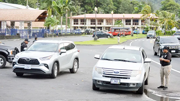 Two police officers stopping vehicles