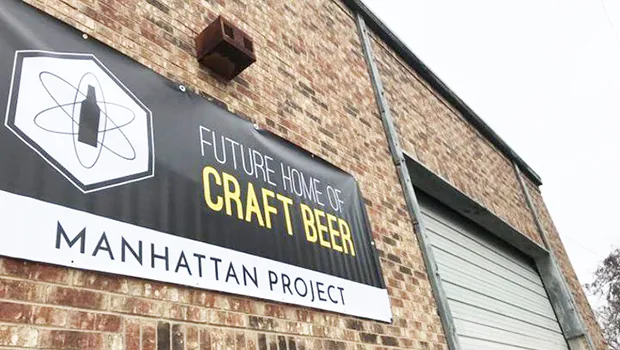 Photo of The Manhattan Project Beer Company building and sign
