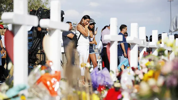 People visit a makeshift memorial in El Paso, Texas
