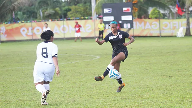 Elcy Lui of Amercan Samoa attempts to control the ball against