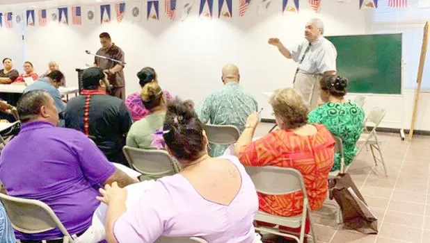 Chief Election Officer, Dr. Lealofi Uiagalelei with poll workers in a file photo taken prior to the election. 