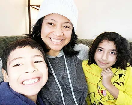 Epifania Rapozo (middle) and her two children