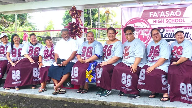 Father Kelemete Puaauli (middle wearing white shirt), surrounded by some of the graduates from Fa’asao High School Class of 1988