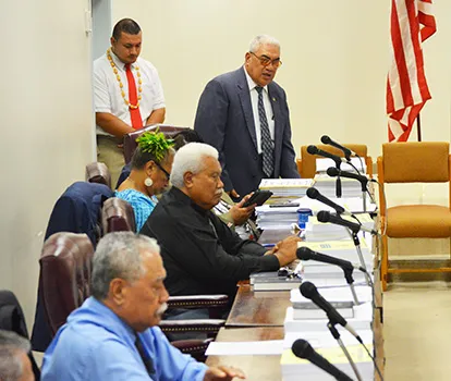 Four representatives at their desks