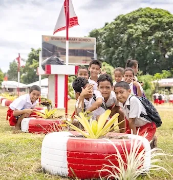 children looking at fala plant