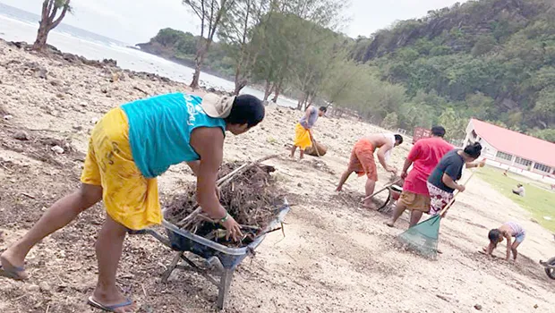 Faleasao residents cleaning up beach