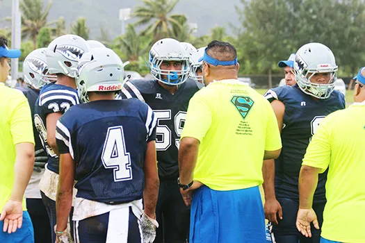 Samoana Sharks head coach, Pati Pati giving advice to his defensive unit 