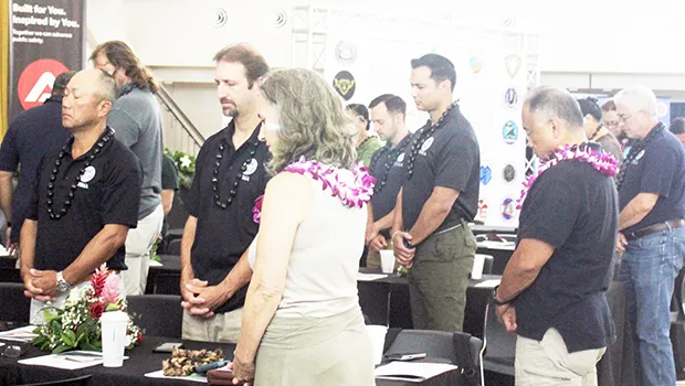 FEMA and Red Cross personnel during a moment of silence