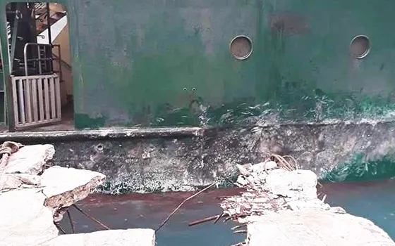 The damaged wharf at Ofu with ferry in background