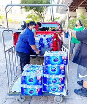 Cases of water on a dolly