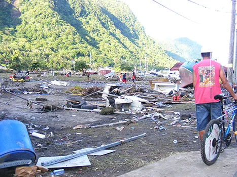 Residents at Pago Pago Park amid debris