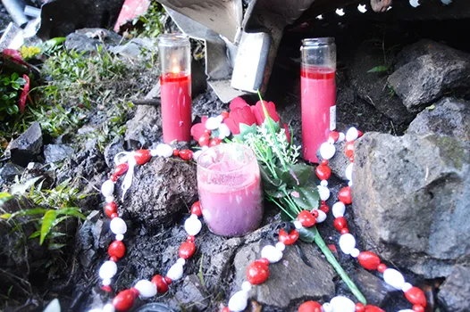 Flowers and candles were placed at the scene where two firefighters were killed