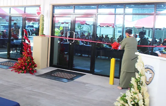 First Lady cutting ribbon at airport quarantine facility