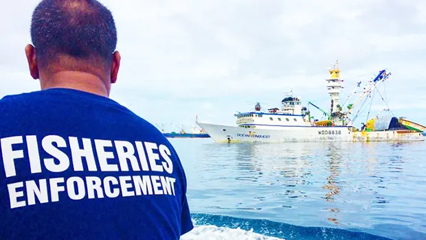  A fisheries officer in Majuro heads out to sea