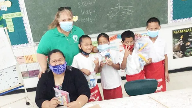 First grade students at Fitiuta hold up gifts