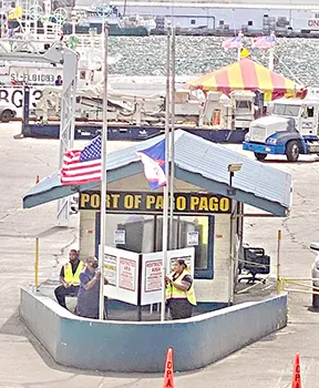 American Samoa and U.S. flags at half staff at Port.