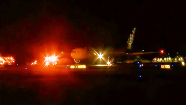 Aircraft on runway at HNL at night during emergency landing