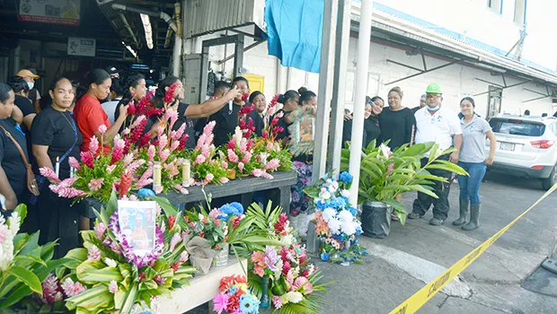 Friends and co-workers of the 4 who died bringing flowers