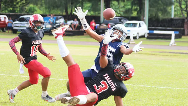 Samoana Sharks Allen Seagai (15) concentrates on trying to catch this long pass from Viliamu Tanielu,