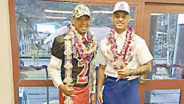 Steven Fiso (left) of Faga’itua High School who signed on with the University of Hawaii, and Eddie Siaumau (right) of Fa’asao Marist High School who signed with the University of Arizona.
