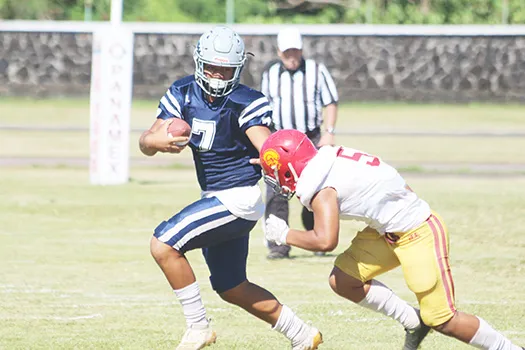 Viliamu Tanielu of the Sharks trying to evade a Tafuna defender