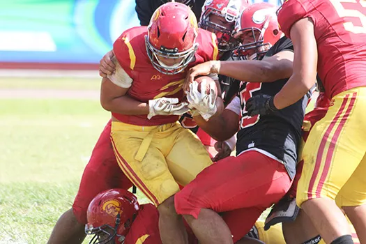 Faga’itua defenders trying to strip the ball out of Koison Ozu’s grip