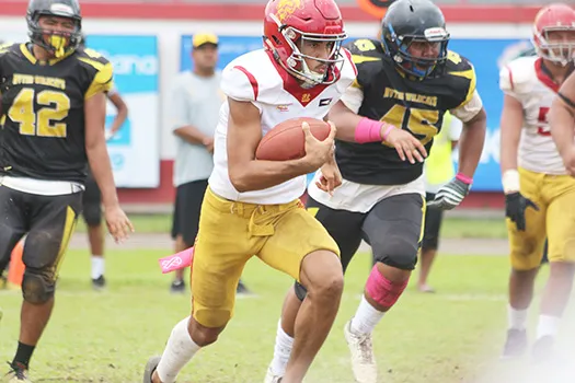 Tafuna Warriors quarterback Oakland Salave’a scrambling 
